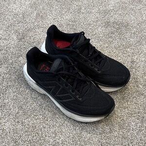 New Balance Women's Black and White Sneakers